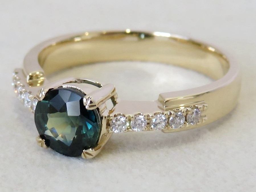 Bespoke 18K yellow gold teal sapphire and diamond ring