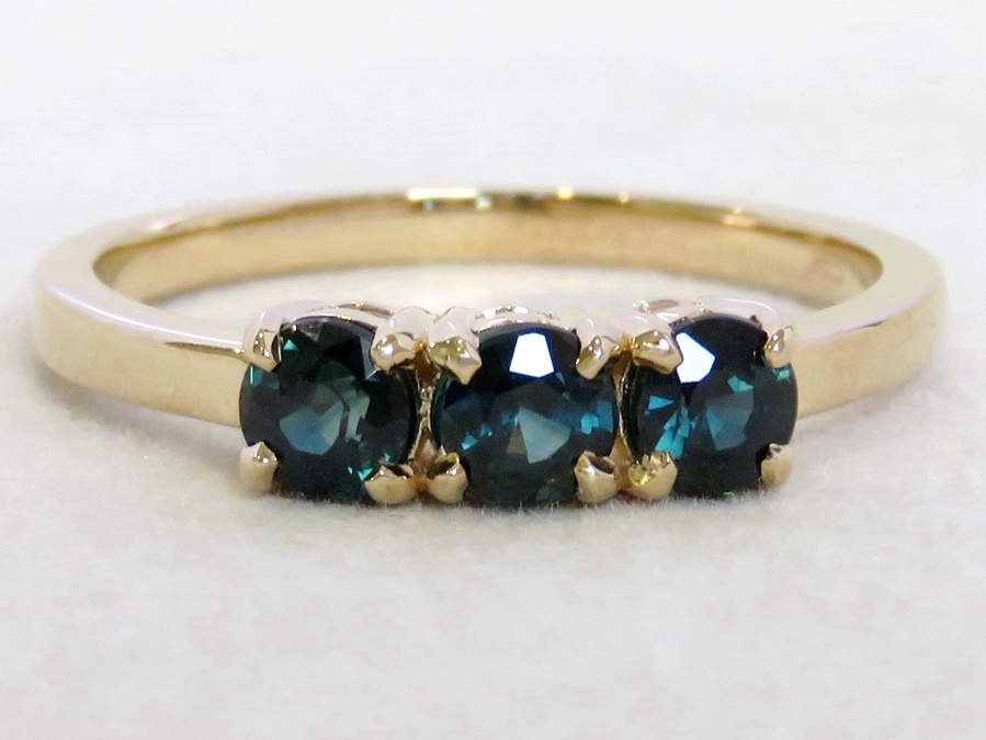 1.15ct Teal Sapphire Three-Stone Ring in 9k Yellow Gold