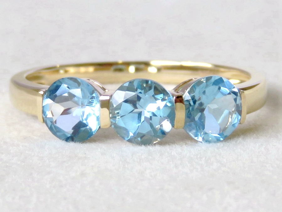 1.7ct Blue Topaz 3-Stone Ring in 9k Yellow Gold